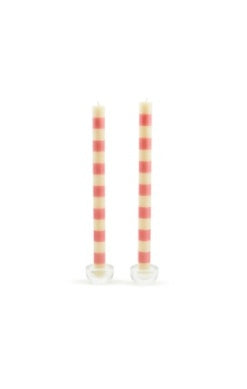 Set of two tall dinner candles with horizontal pink and cream stripes in clear glass holders.