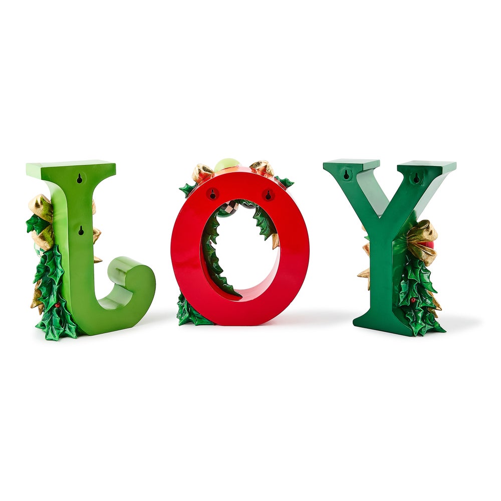 Set of three illuminated resin letters spelling JOY in red and green with holly and bow accents.