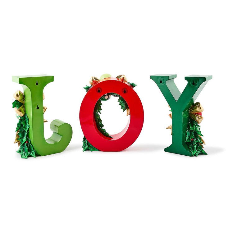 Set of three illuminated resin letters spelling JOY in red and green with holly and bow accents.