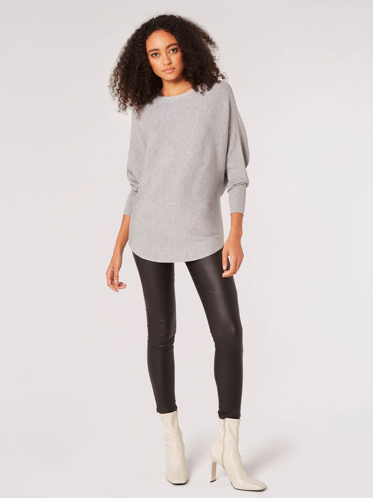 Evelyn Lurex ribbed batwing top in black with long sleeves and a relaxed silhouette.