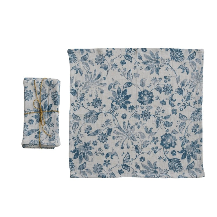 Set of four cotton slub napkins featuring a blue floral print on a white background.