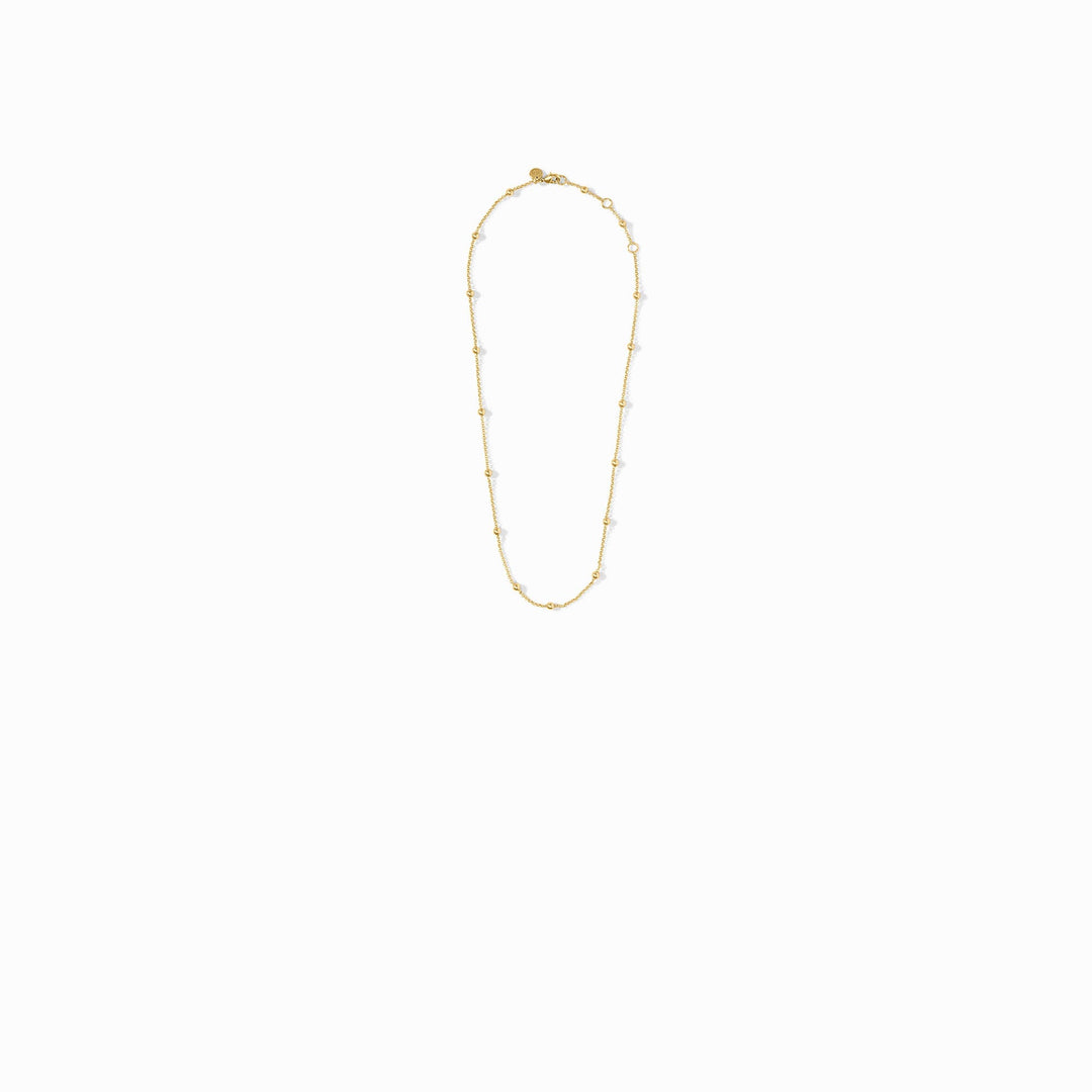 Solara Delicate Station Necklace in gold, featuring a thin chain with small gold bead accents.