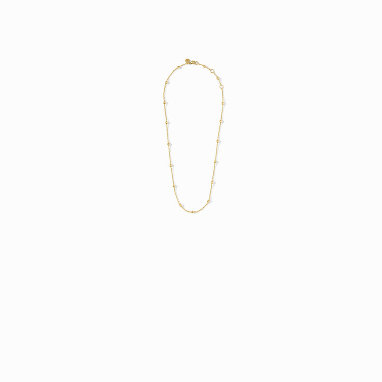 Solara Delicate Station Necklace in gold, featuring a thin chain with small gold bead accents.