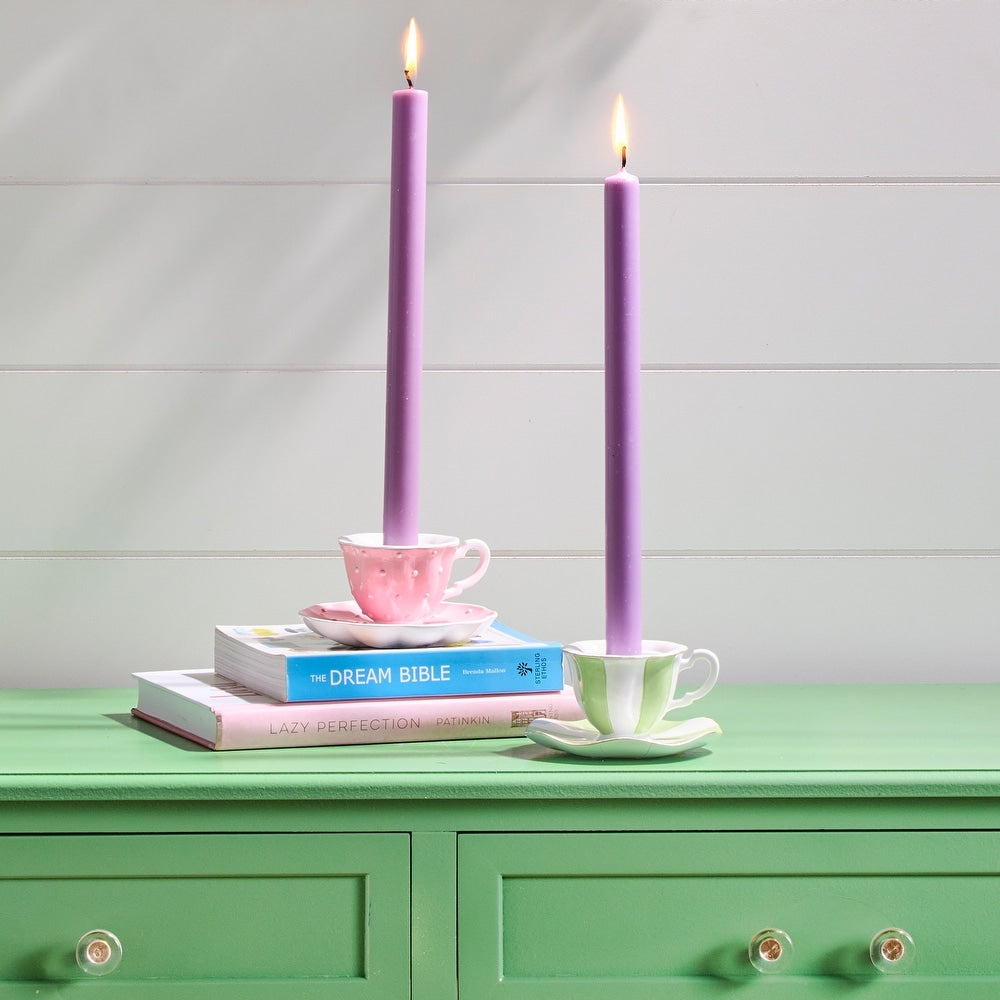 4.5-inch tapered resin tea cup candle holder in light beige with a whimsical floral pattern.