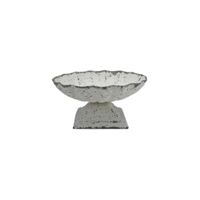 White painted cast iron bowl with a distressed finish on a square pedestal base.