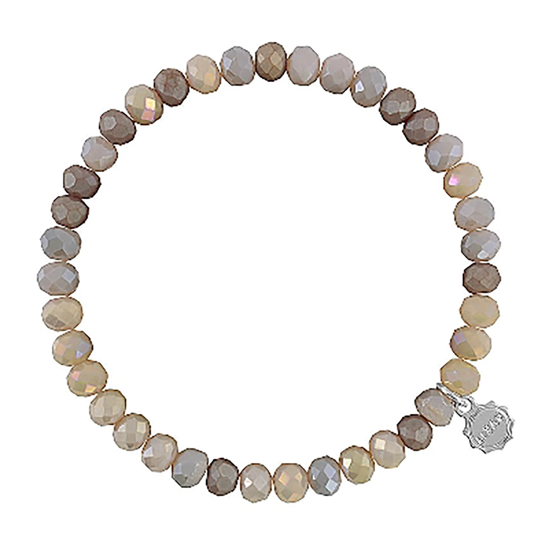 Lizas Quadro Big crystal stretch bracelet with faceted neutral-toned beads and a silver charm.