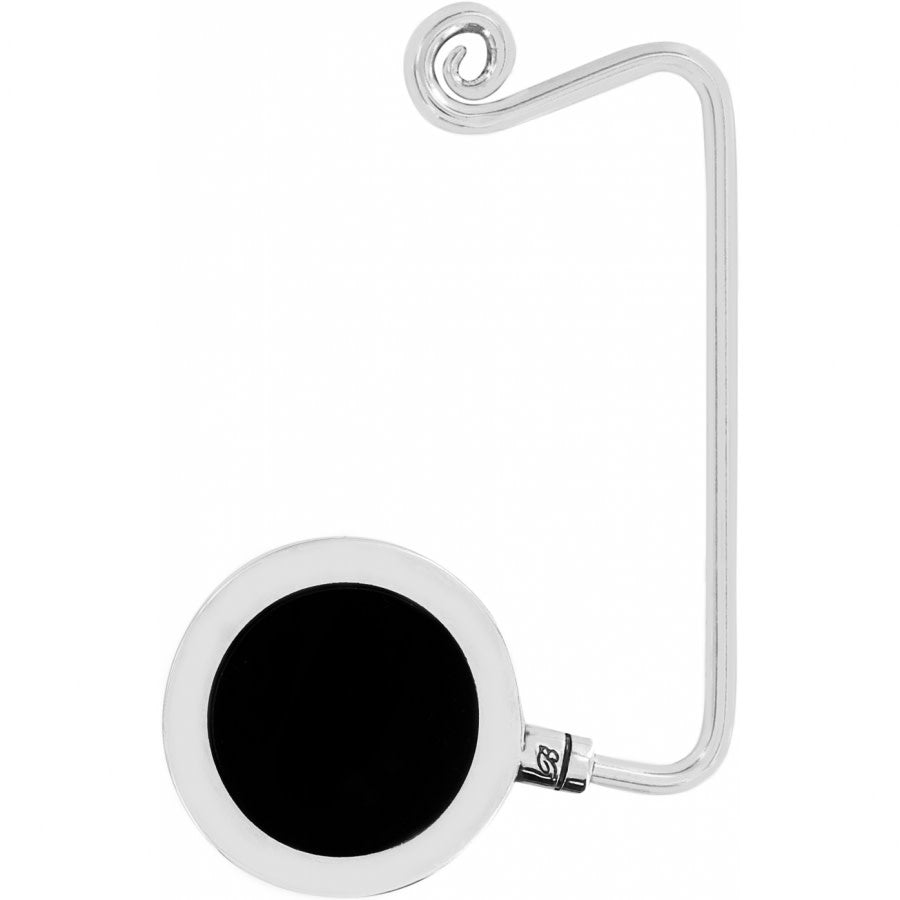Silver plated Ferrara handbag hook with a curved silhouette designed to balance on desk edges.
