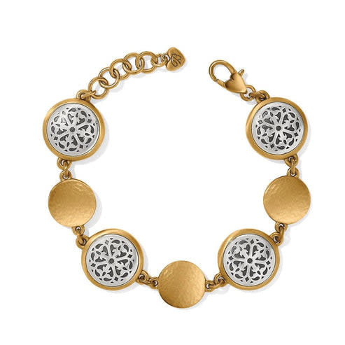 Two-tone silver and gold hammered link bracelet with engraved rose window-inspired pattern.