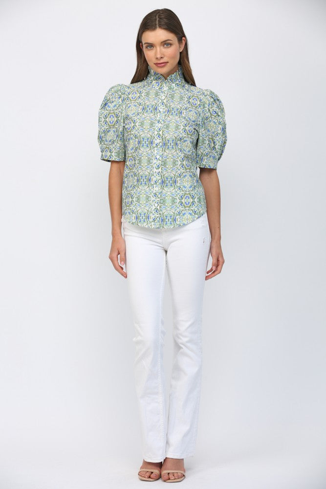 Woman wearing Eliana Puff Short Sleeves Ruffle Neck Button Down Top in a blue and green pattern.
