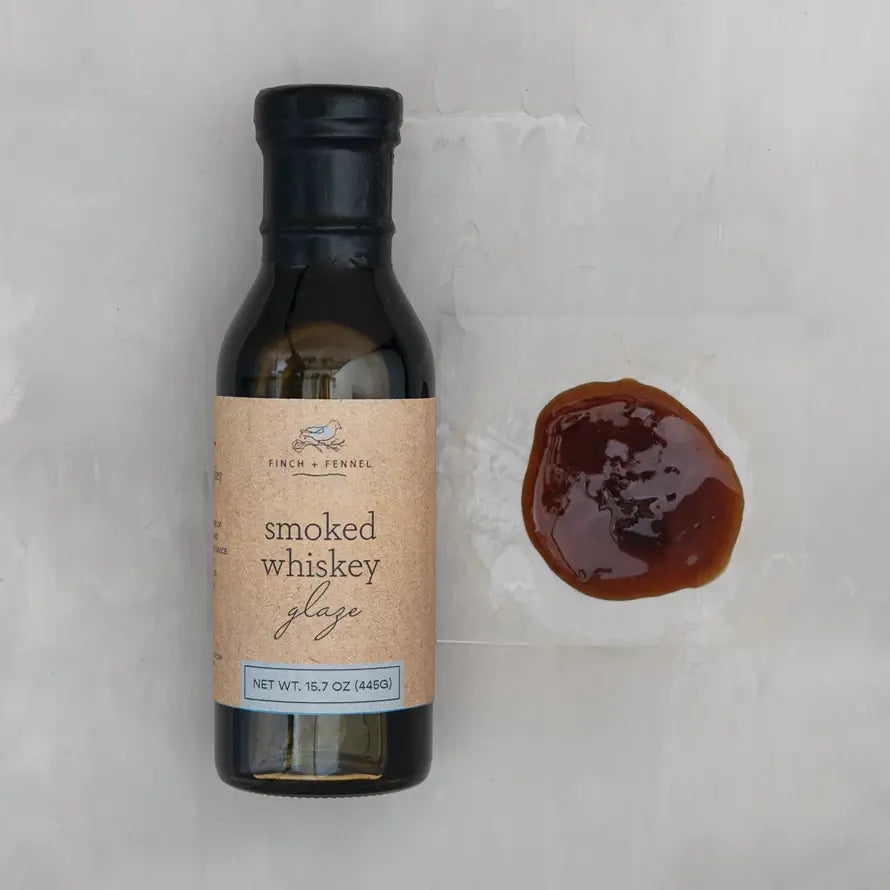 Bottle of Smoked Whiskey Glaze with a dark amber liquid visible through the glass.