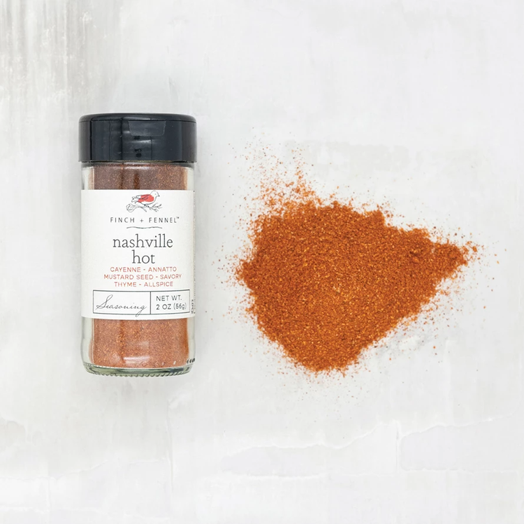 Glass jar containing Nashville Hot Seasoning with a red spice blend visible through the clear container.