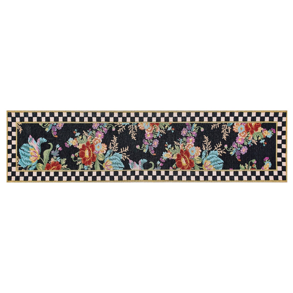 Washable runner rug with floral market print in neutral tones on a polyester base.