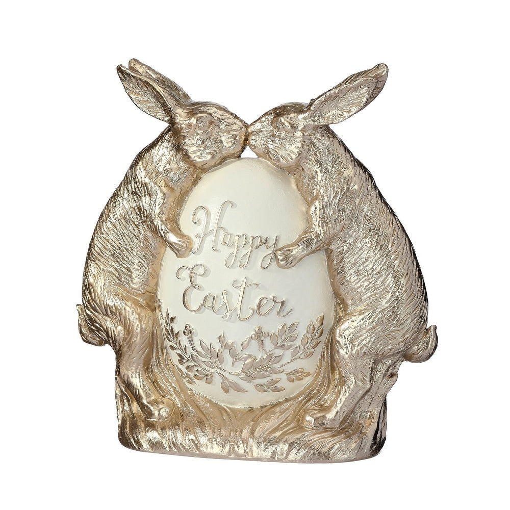 Resin decorative bunnies in ivory and champagne tones sharing a moment over an egg