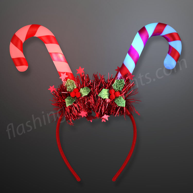 Blinky Candy Cane Headband with red tinsel, holly leaves, and red and blue light-up candy canes.