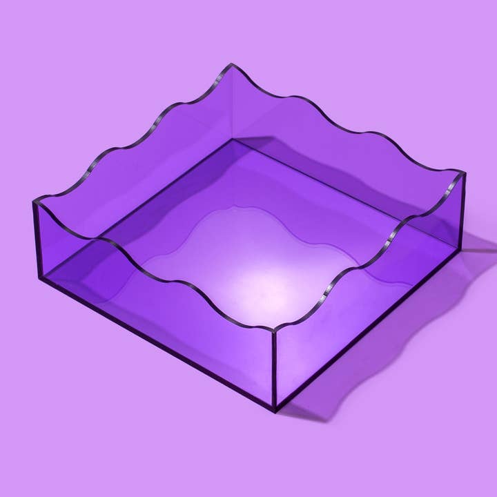 Square acrylic tray with wavy edge detail in clear material