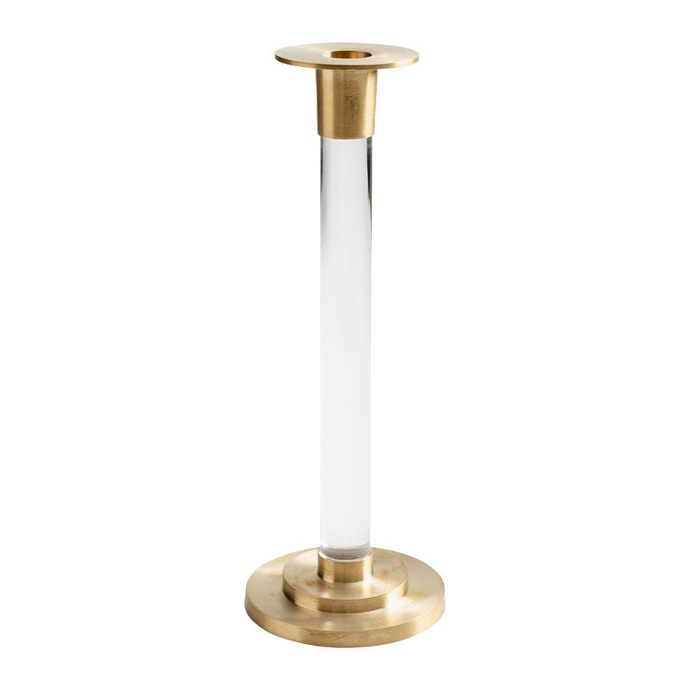 Large brass candlestick with resin accents holding a clear tapered Caspari candle