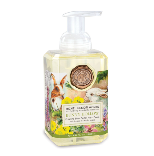 Foaming hand soap dispenser in a clear bottle with white liquid inside.