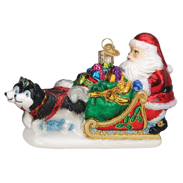 Glass Santa's Dog Sled ornament featuring Santa in a red sleigh pulled by two huskies.