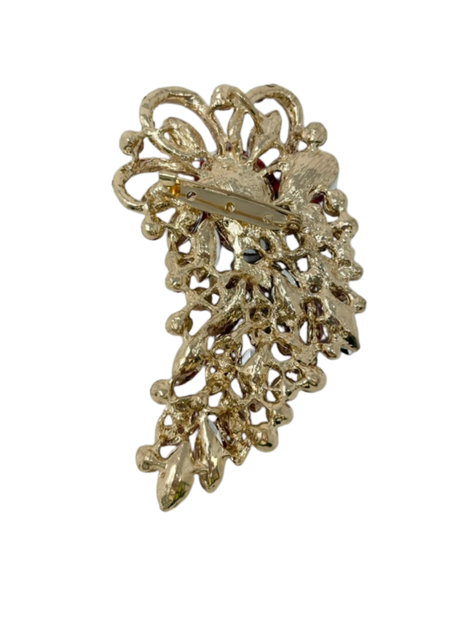 Back view of a gold-tone red gemstone brooch showing the pin clasp and intricate metalwork.
