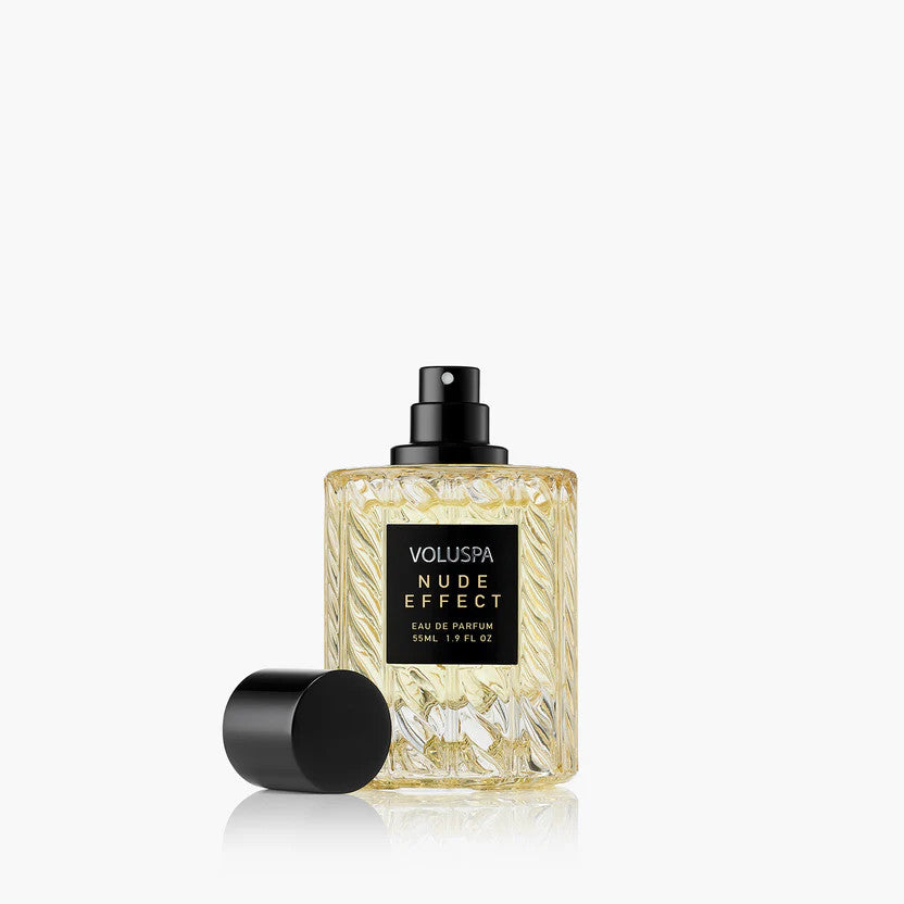 Voluspa Nude Effect 55ml Eau De Parfum in a textured glass bottle with a black spray nozzle and cap.
