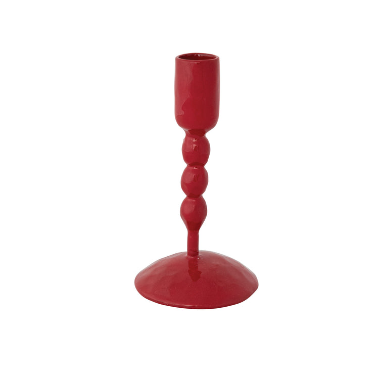 Red hand-forged enameled cast iron taper candle holder with a beaded stem and round base.