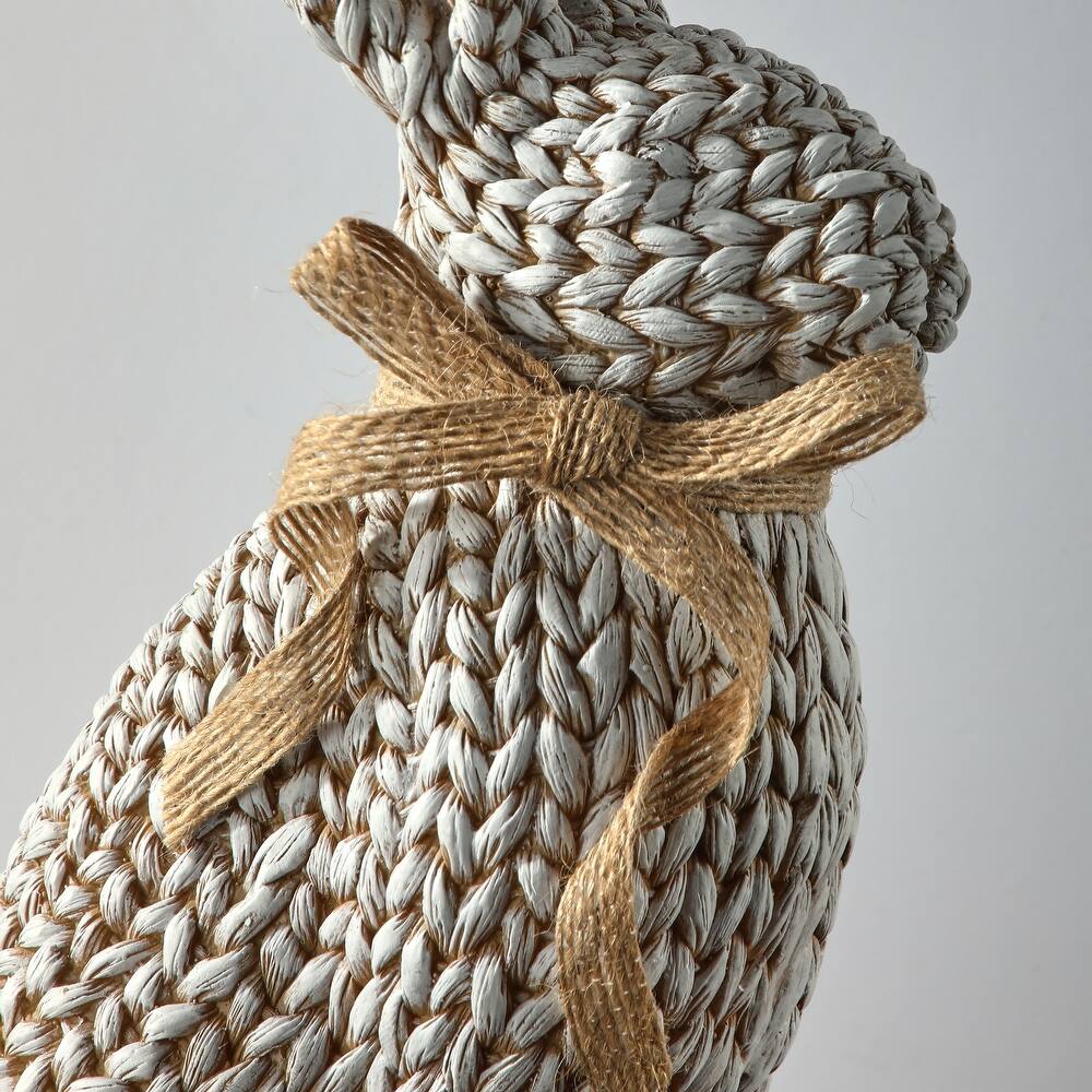 Woven resin rabbit figurine with a textured surface in natural beige tones.