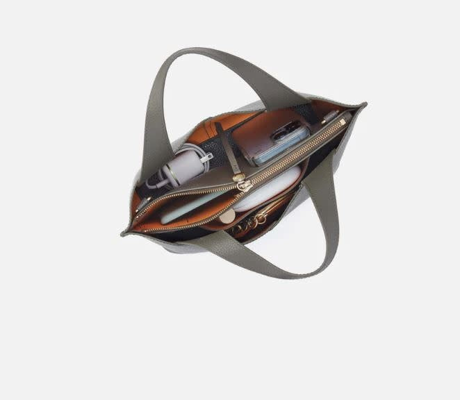 Vida small tote bag in biscuit leather with brushed antique brass hardware.