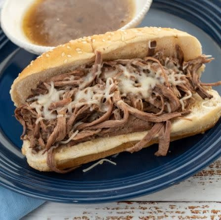 Open bag of Mouthwatering French Dip powdered beef mix with visible onion soup seasoning.