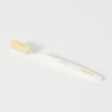 Ivory handle toothbrush with soft natural boar bristles in a vintage-inspired silhouette.