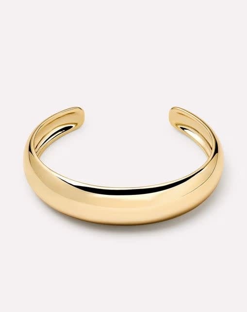 Polished gold plated brass cuff bracelet with a chunky polished finish.