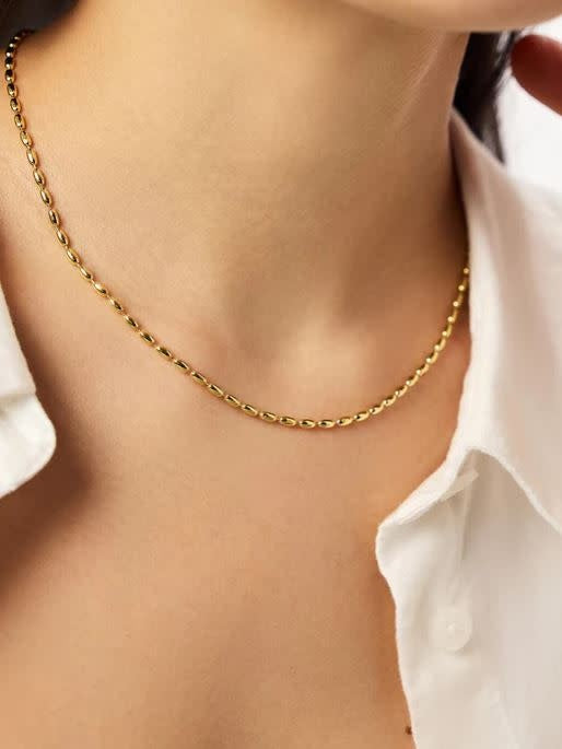 Minimalist ball chain necklace in polished gold with a lobster clasp.