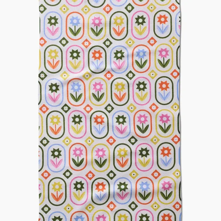 Spring tea towel with petal patchwork print in waffle weave construction