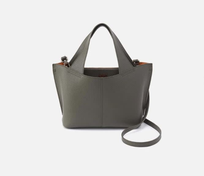 Vida small tote bag in brushed antique brass hardware with biscuit leather interior.