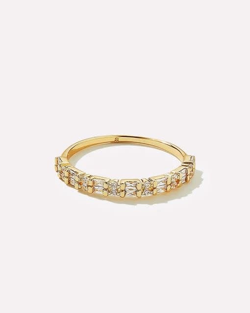 Darcy stackable ring in gold with baguette-cut and round cubic zirconia stones.
