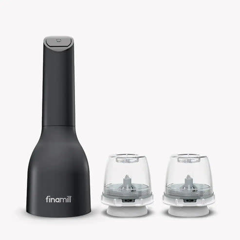 Midnight black FinaMill electric spice grinder with two attached grinding pods