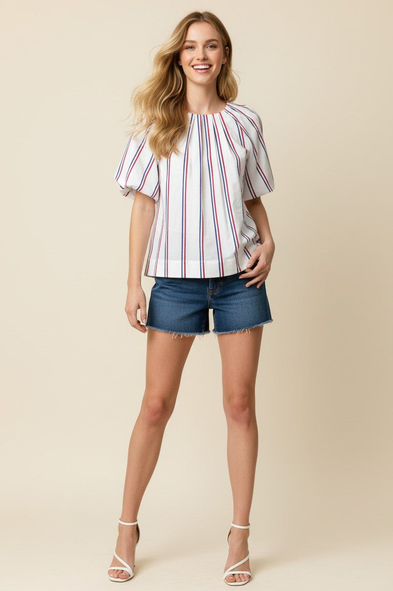Stella USA inspired stripe blouse in cotton with round neck, balloon sleeves, tucked detail, and back button closure.