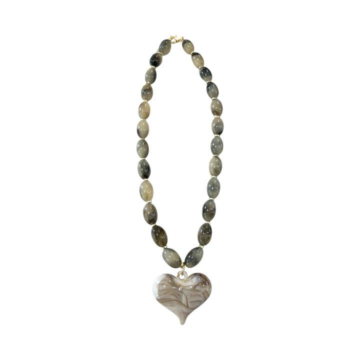 Roxie necklace featuring a bold geometric pendant on a delicate chain.