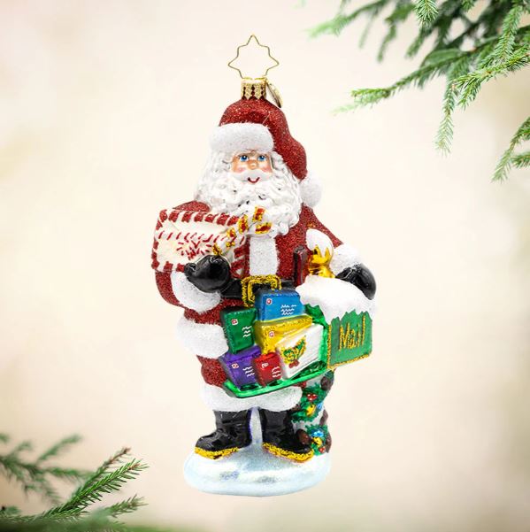 North Pole Mail Delivery holiday ornament shaped like a red mailbox with white snowflake pattern and silver accents.