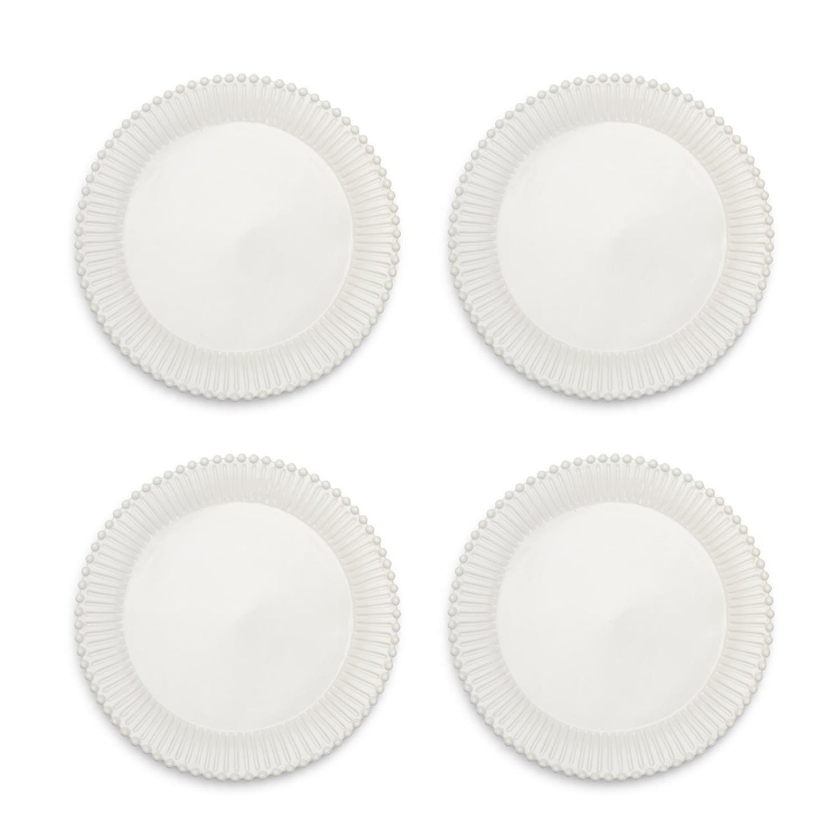 Set of four white ceramic dinner plates with a fluted rim and pearl edge detail.