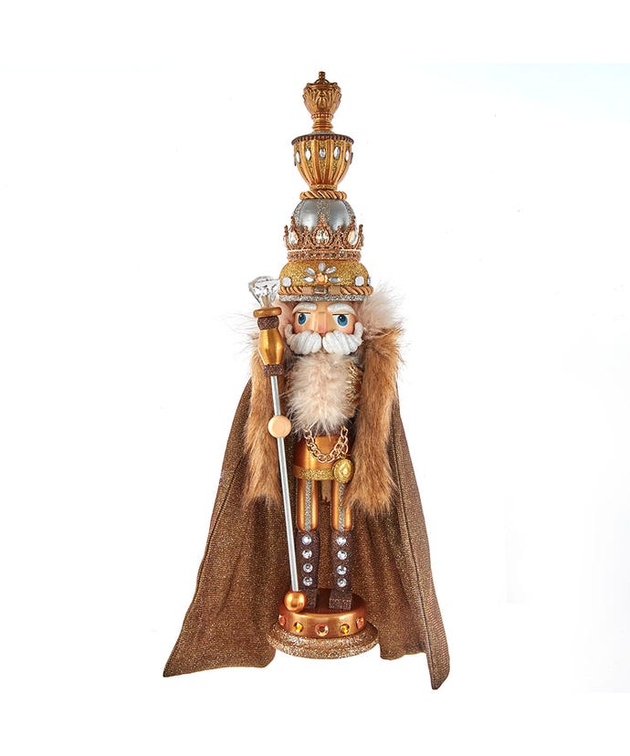 Gold King Nutcracker with amber gemstone accents holding a staff on a glittered base