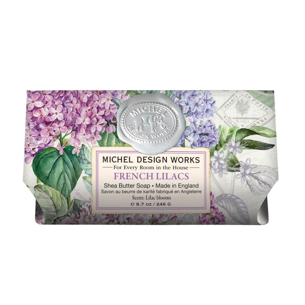 Michel Design Works French Lilacs shea butter soap bar with floral pattern and wax seal logo.