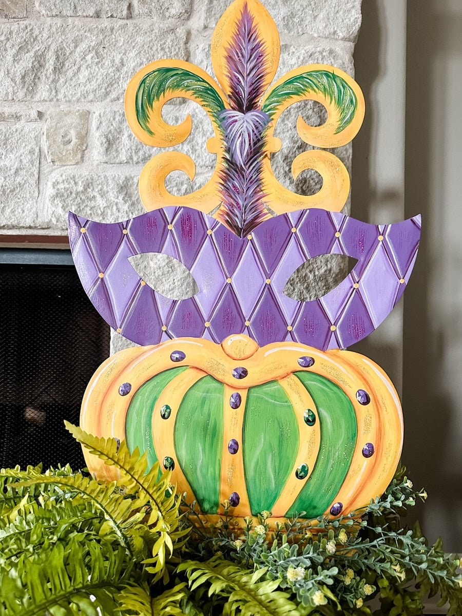 Mardi Gras topiary with green foliage on a stake stand
