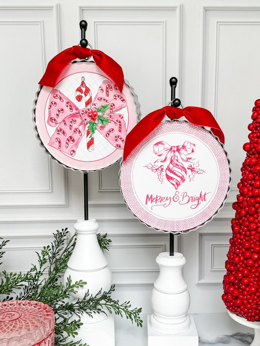 Beck's Vintage Candy Cane Bow ornament in red with white stripes hanging from a gold loop.
