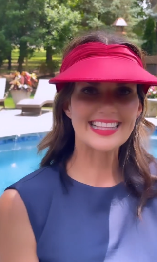 Women's open-top sun visor hat with wide brim in bright contrasting colors and elasticized chinlon fabric.