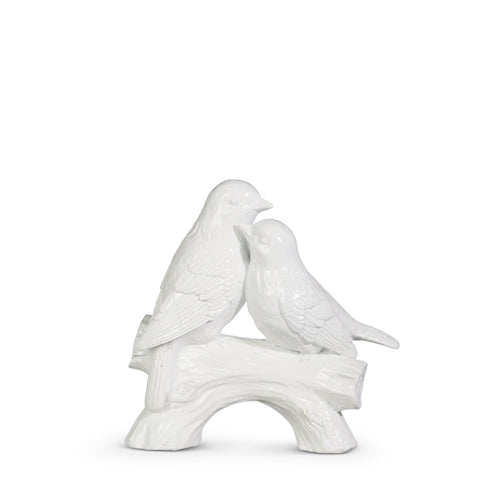 Resin decorative bird figurine perched on a branch with natural brown tones.