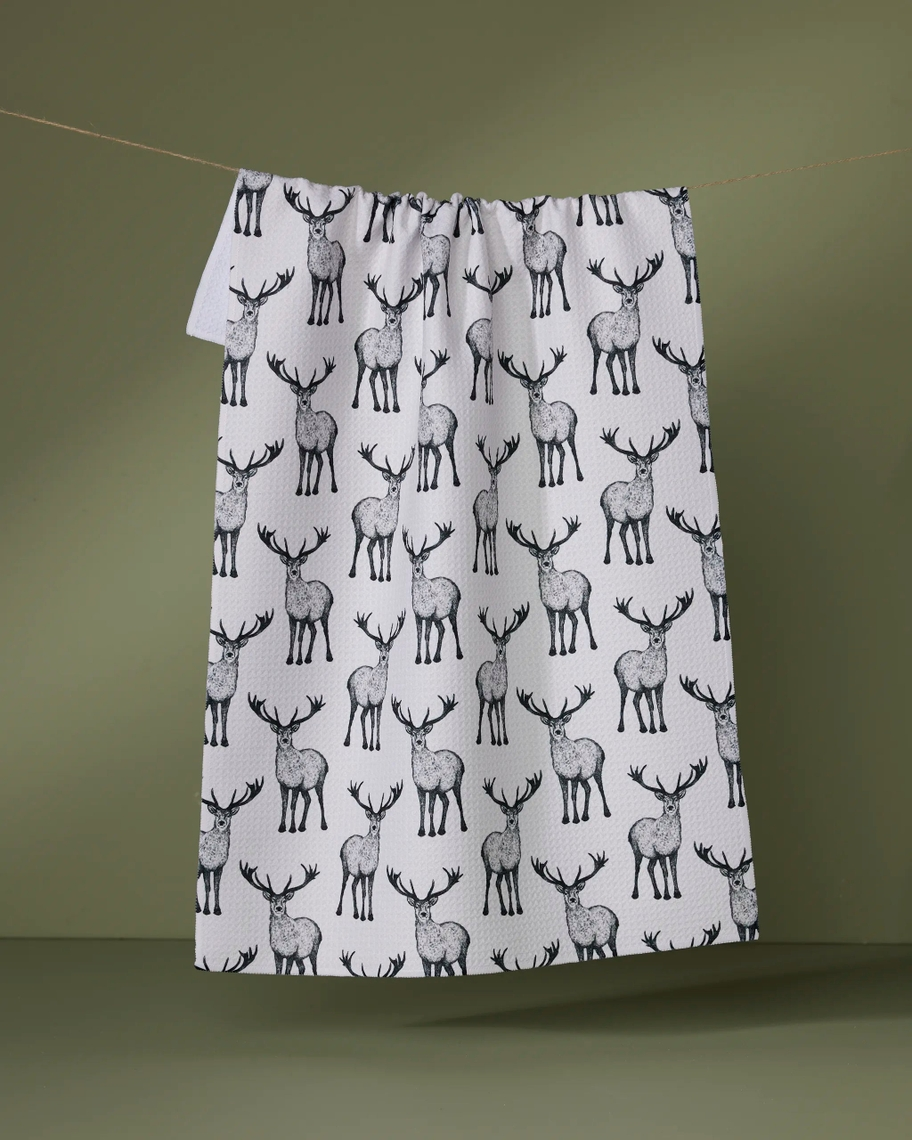 Everyday Tea Towel featuring a black and white hand-drawn stag pattern on a white waffle-knit fabric.