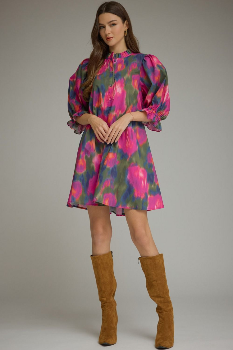 Agatha Printed Puff Sleeve Mini Dress with a ruffled mock neck and brown suede boots.