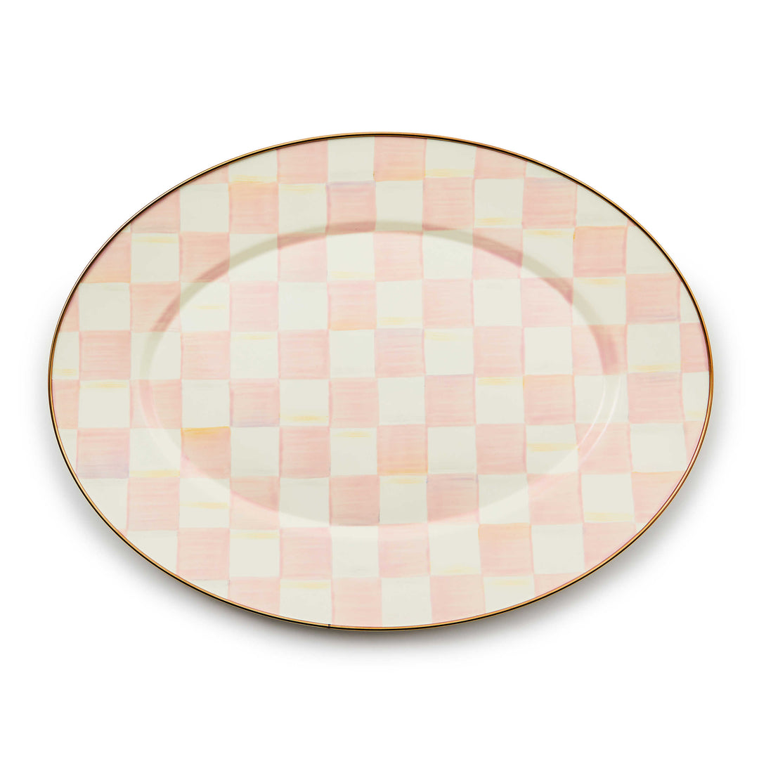 Oval platter with a hand-painted pink and white checkered pattern and a bronzed stainless steel rim.