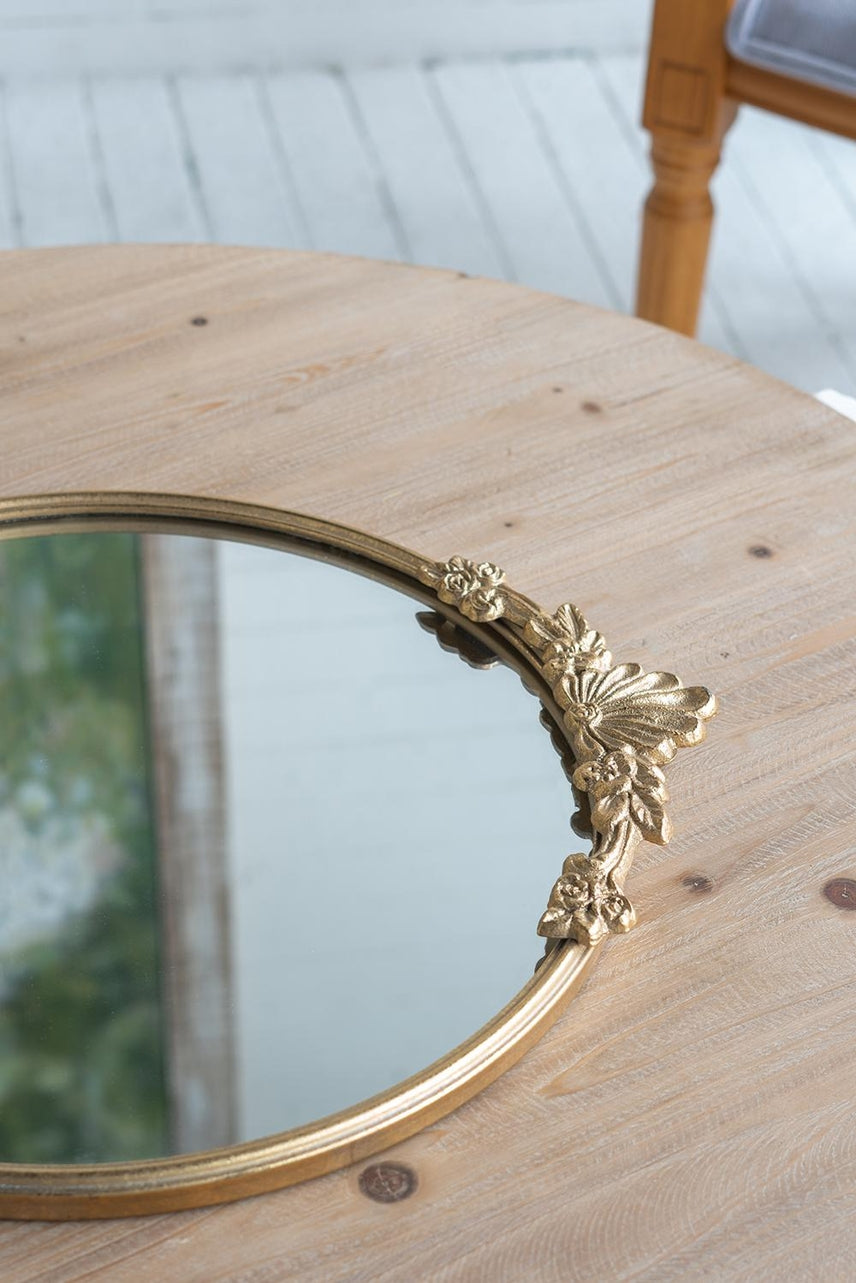 Gold iron frame mirror tray with intricate floral cutout patterns