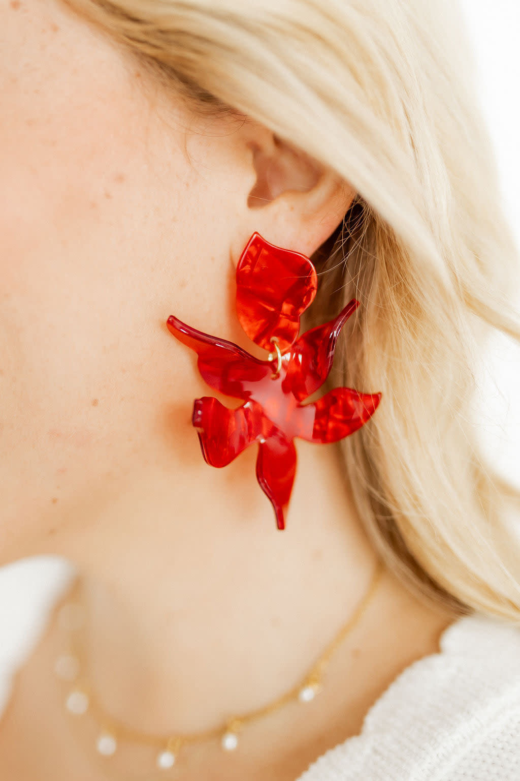 Pearlized red abstract floral drop earring with feather-light weight.